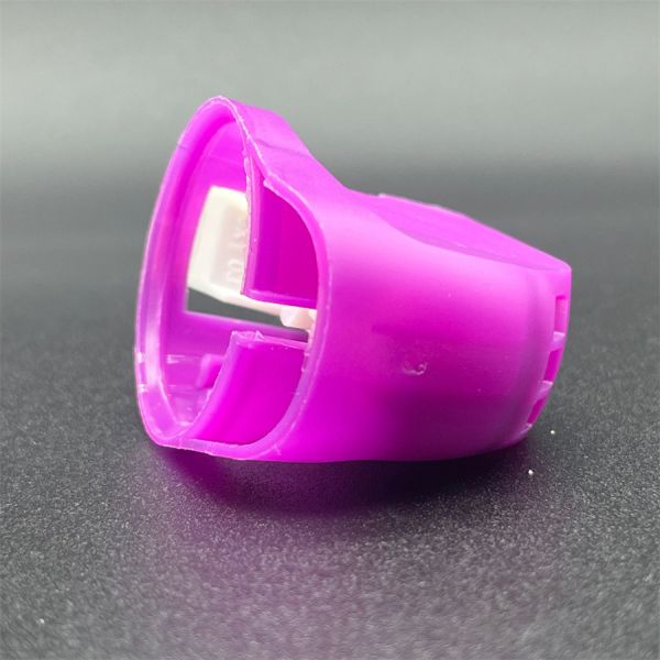 Close-up view of spray gun's adjustable nozzle mechanism