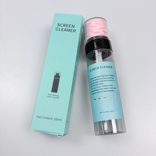 Close-up view of screen cleaner spray and microfiber cloth