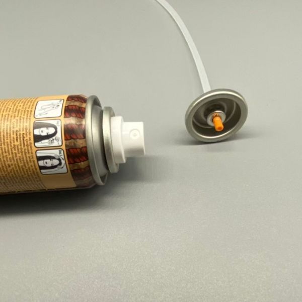 Dry shampoo aerosol spray valve close-up view showing nozzle design