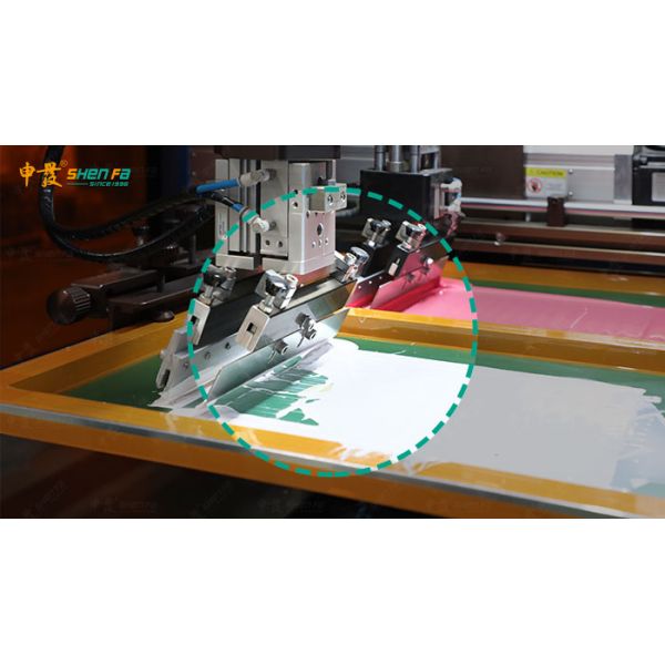Screen printing machine in operation