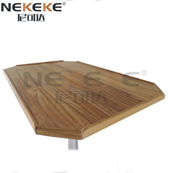 Close-up view of teak table top showing wood grain and fiddle detail