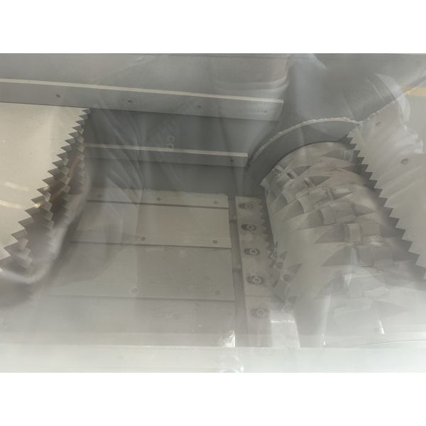 Close-up view of shredder cutting mechanism