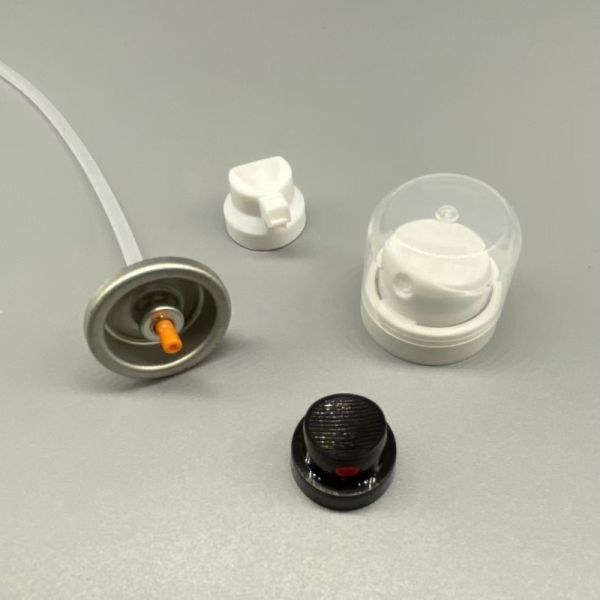 Dry shampoo valve mechanism demonstrating spray pattern